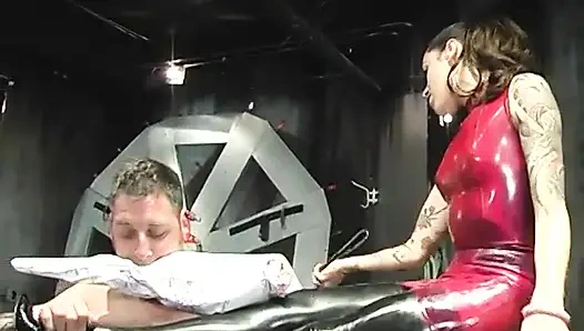 Slim brunette dominatrix humiliates and degrades male slave in her lair