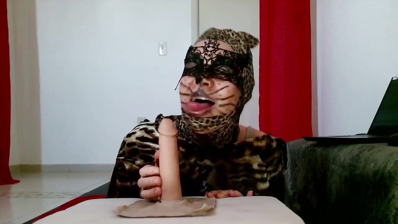 Hungry CatWoman shows how to use tounge on dick