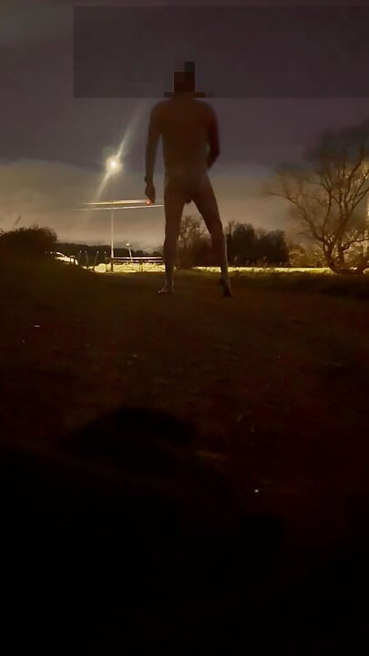 Strip naked and barefoot on a lane by a road , beat my hard meat as cars passed