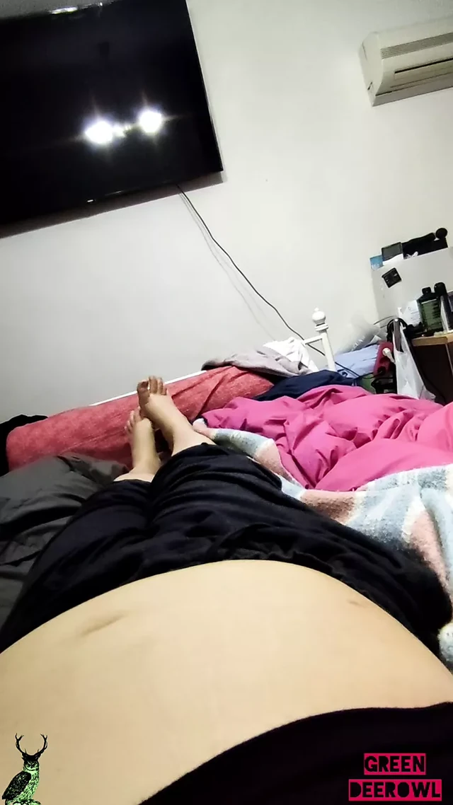 Playing with my feet on the bed