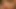 Lüks büyük memeli orta yaşlı seksi kadın kahvesine biraz krem sunuyor