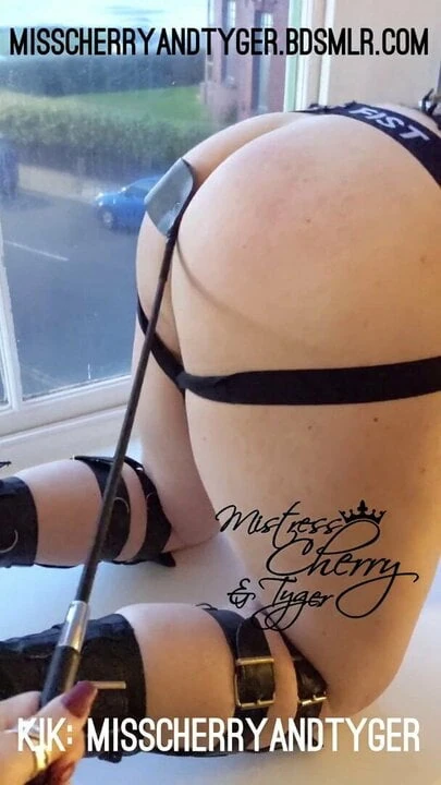 Mistress Cherry spanks tc in her bay window for all to see.
