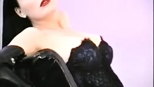 Dita Von Teese poses in corset