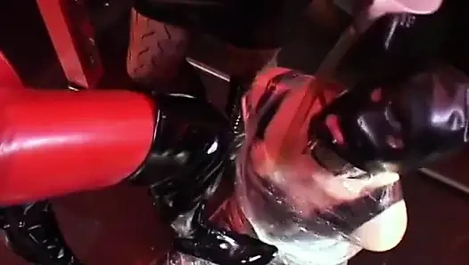 Cute filn-coated babe gets her pussy fucked by couple of strict mistresses in black