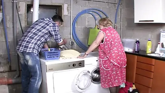 German granny in stockings rides dick in the laundry room