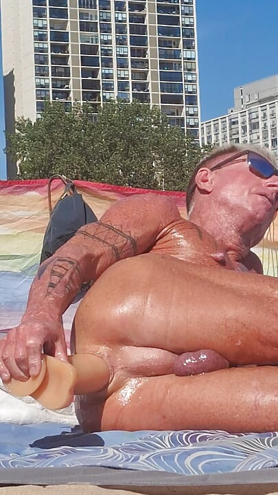 Key West oiled up using his new larger dildo at the beach