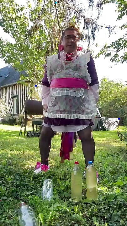 In gardener's outfit to take a piss shower with 4 bottles