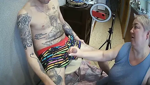 I'm sitting on a stool, a fat woman jerks off my cock