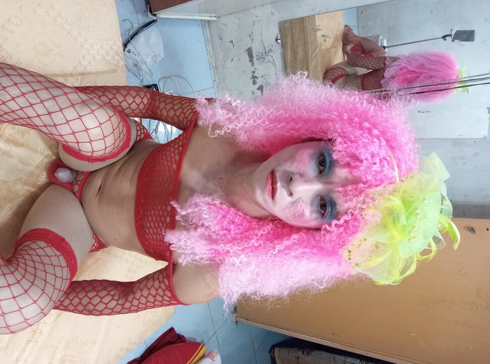 Oanh Le transgender wearing sexy lingerie playing with a fake can