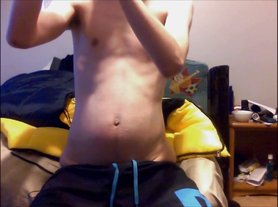 Young Guy Fills His Stomach with Water