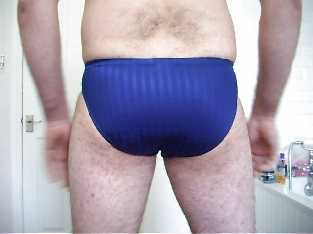 Trying on speedo and adidas swim trunks briefs. Masturbate and cum in speedo then put them on.