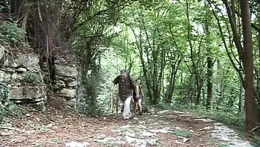 Naughty teen gets fucked by a mature guide in the woods