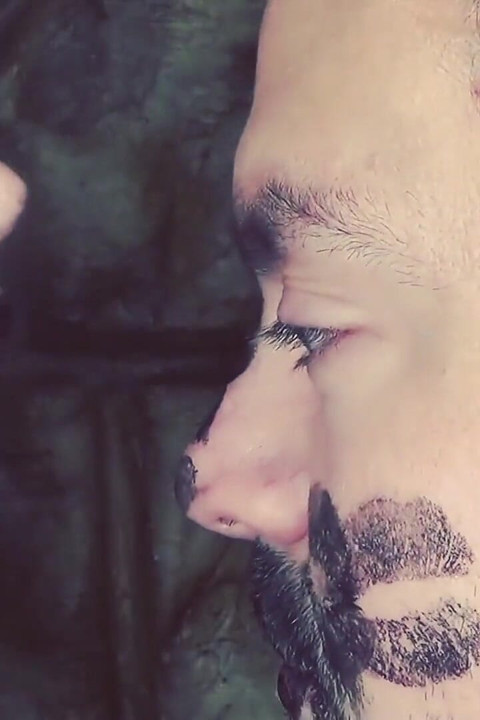 Covering Alex with black shiny lipstick kisses all over his face!