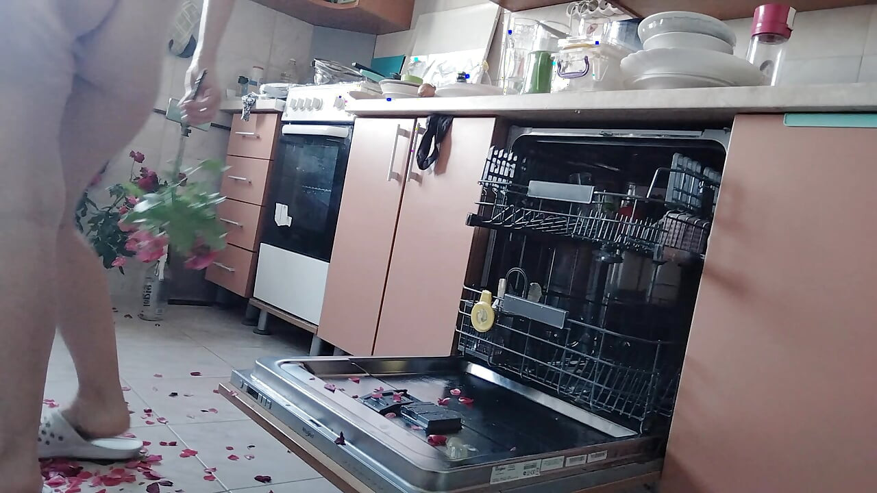 Sexy nude wife preparing food in the kitchen. Hairy brown hair, big ass, big tits.