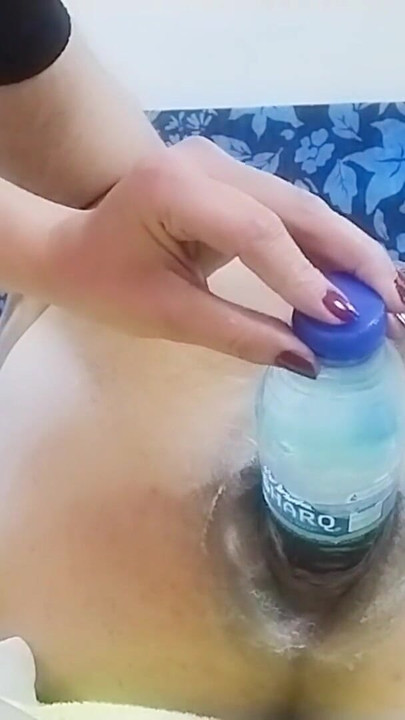 Mistress Shoving a water bottle inside her male Slave | Clip 2