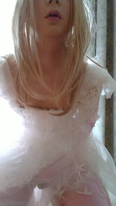 A cross-dressing boy wearing a white wedding dress masturbated comfortably while touching his dick with pink gloves. | Clip 1