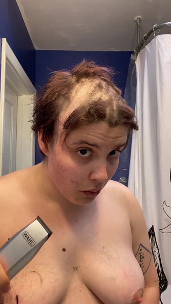 Iconic moment from "Hairless Whore - Adama Daat Amateur Fetish Head and Brow Shave"