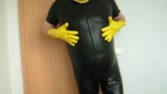 in my tight rubber short suit showing my fat man tits