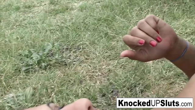 Knocked up slut takes care of a cock outdoors
