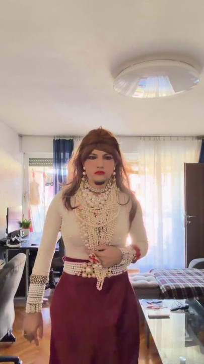 Crossdresser walking around heavily aroused  the apartment in the high heels and lovely pearls and heels.