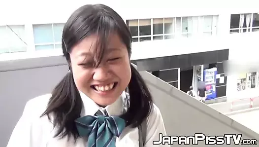 Young Japanese schoolgirl pisses her panties outdoor