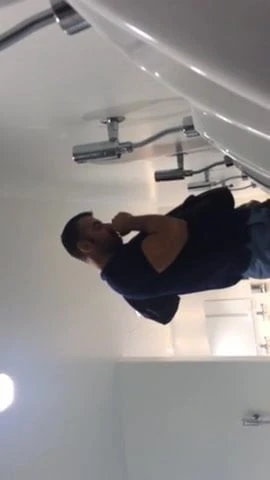 Muscle step dad pees, checks his phone, takes his time