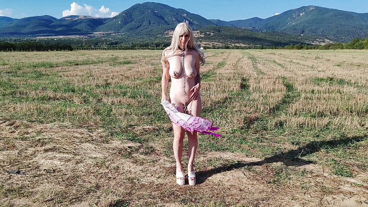 Slave Tih Ie Walks in Skirt and Clitoral Chains