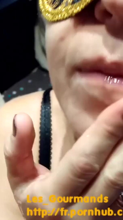A masked MILF in sexy lingerie sucks her husband's cock and plays with his cum in her mouth. | Clip 1