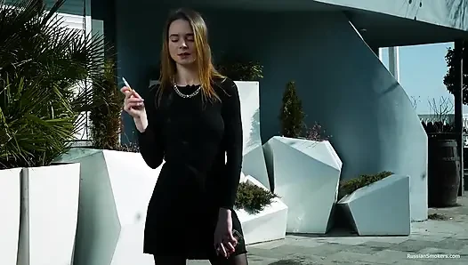 Young Russian Girl Smoking Cigarette by Seaside