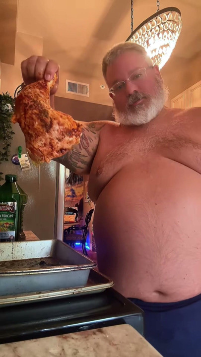 The handsome sexy big bear cooks dinner for you