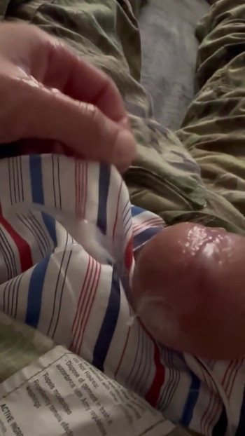 Emotional moment from "Soldier uses vaseline and his cock to have fun wearing his uniform and sarge's boxer shorts!"
