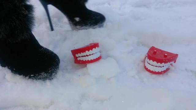 Winter crush: Lady L  crush teeth with sexy black boots.