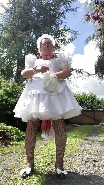 In an outfit with a short wedding dress with a layer for a day.