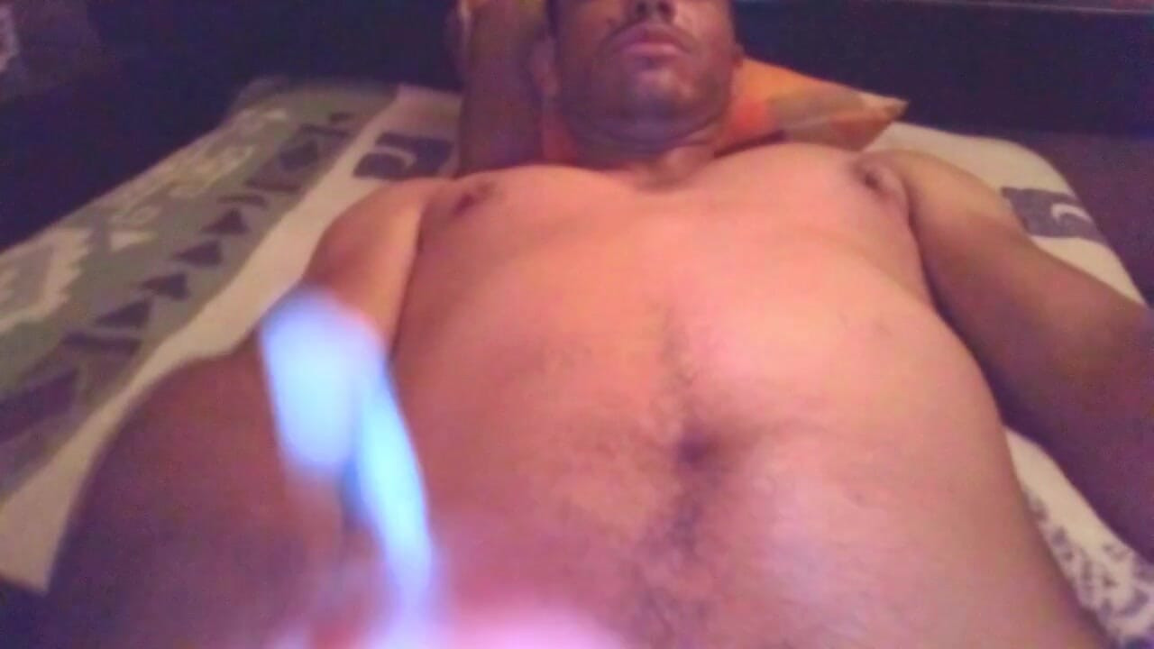 Masturbating