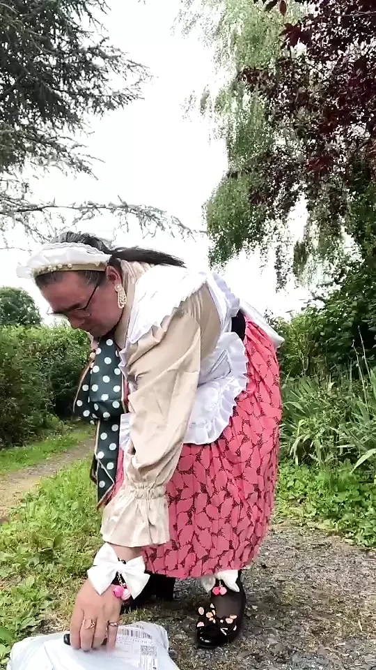 In vintage maid outfit to go pick up a package from the mailbox.