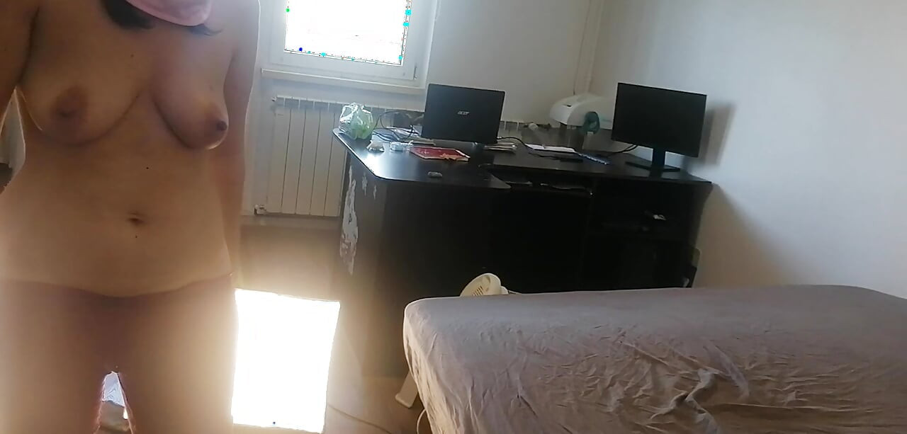 Amateur woman has fun trying on clothes and cutting them. Amateur woman vacuuming naked in the house.