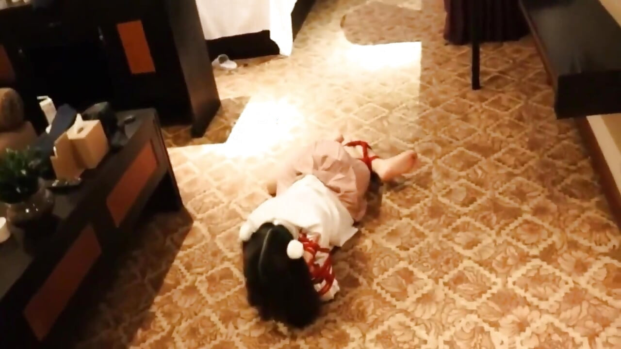A Cute Little Dressed in a Jk Uniform Was Walking Around Barefoot on the Ground.