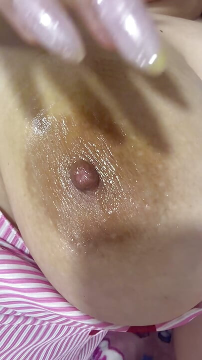 Mom oils herself very delicious and massages her tits