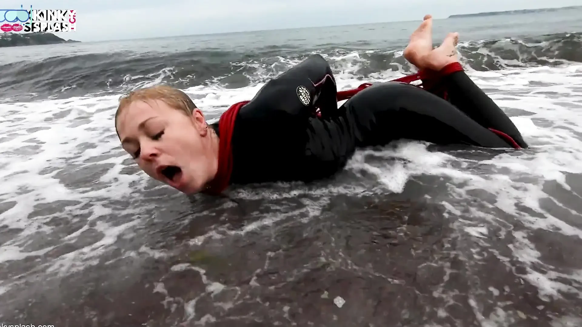 Hogtied in a Wetsuit – Rope Bondage Escape Challenge on the Beach