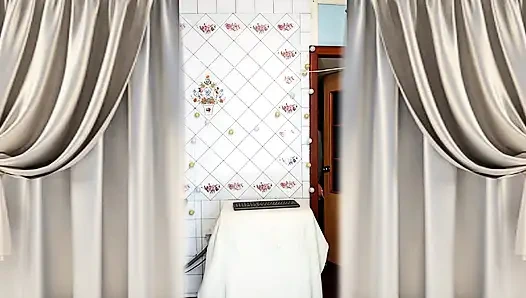 Hot housewife Lukerya with disheveled hair drinks tea and twerks in the kitchen.