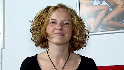German blonde slut plays with a big dildo in solo action