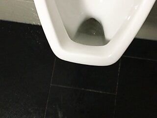 Pissing over the toilet at work