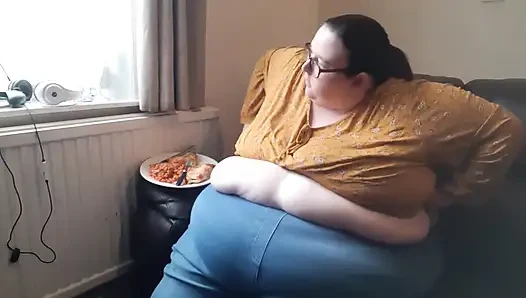 SSBBW huge belly whilst eating on sofa