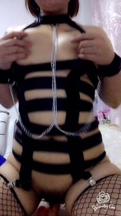 chinese girl has fun with a dildo and her boobs