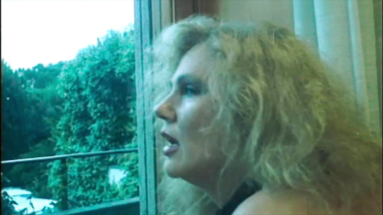 Marina Lotar in 2 Vintage Scenes: a Threesome and Doggy Style with Roberto Malone.