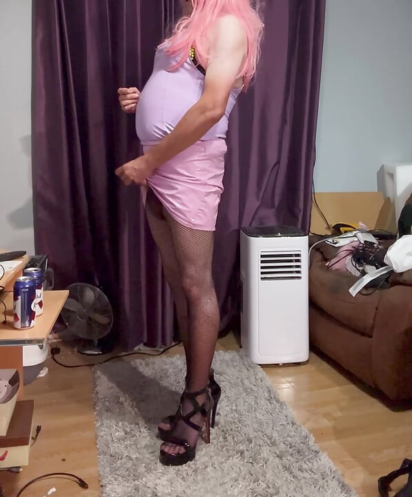 Dressed in pink pvc, fishnets and high heels and edging with lots of cum
