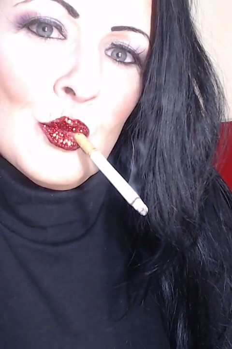 Closeup smoking red glittered lipstick