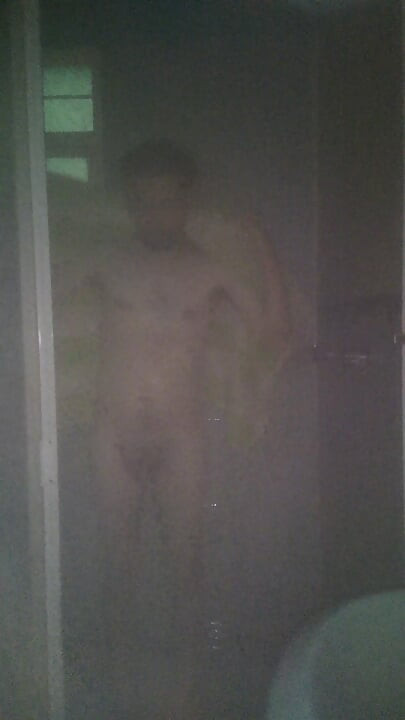 Man Showering with Flashlight On