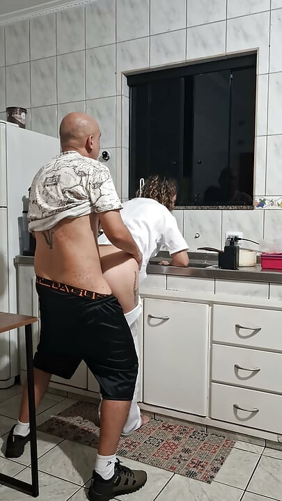 Banging the maid from behind in the kitchen.