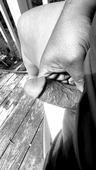 Jerking of on the deck in black and white.